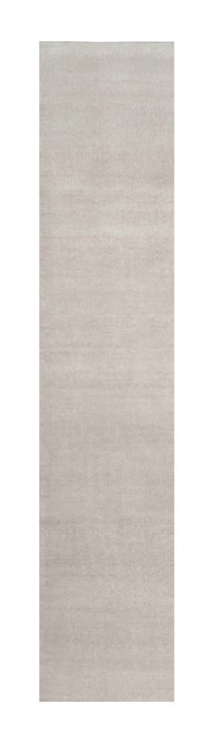 Rug & Kilim’s Oversized Contemporary Textural Solid Rug in Ivory Tones