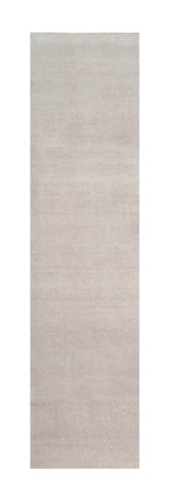 Rug & Kilim’s Oversized Contemporary Textural Solid Rug in Ivory Tones