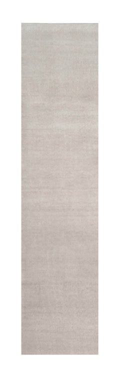 Rug & Kilim’s Oversized Contemporary Textural Solid Rug in Ivory Tones