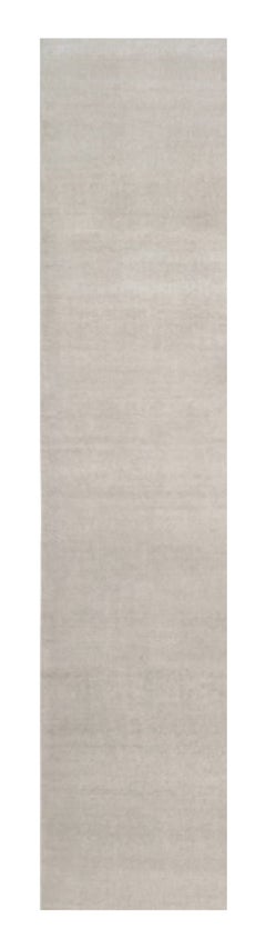 Rug & Kilim’s Oversized Contemporary Textural Solid Rug in Ivory Tones