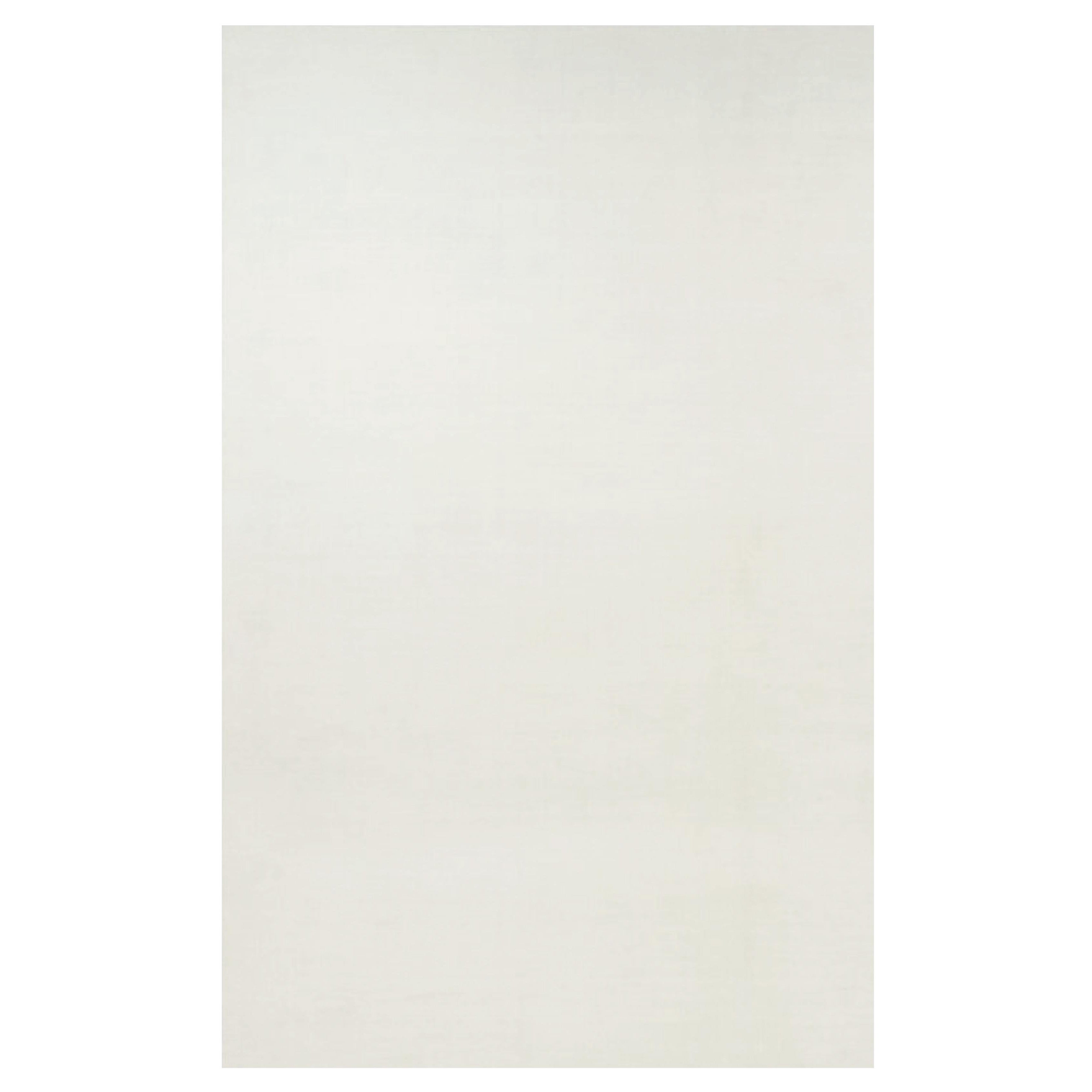 Rug & Kilim’s Oversized Contemporary Textural Solid Rug in White Tones