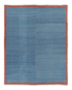 Rug & Kilim’s Oversized Custom Dhurrie Rug in Blue and Rust Geometric Patterns