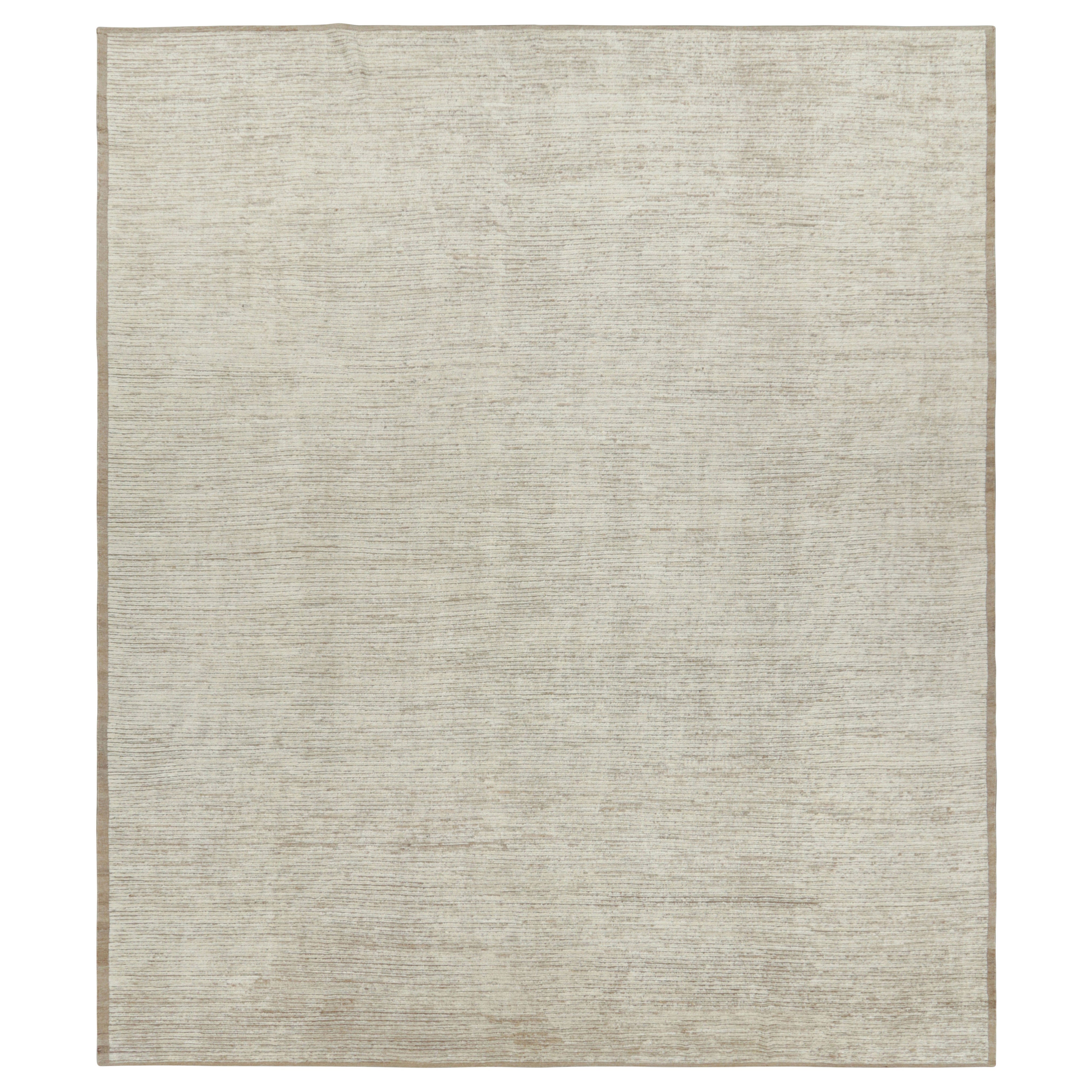 Rug 
Kilim è un kilim sovradimensionato con strisce e striature testuali beige e bianche.