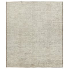 Rug 
Kilim è un kilim sovradimensionato con strisce e striature testuali beige e bianche.