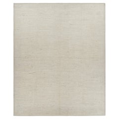Rug 
Kilim è un kilim sovradimensionato con strisce e striature testuali beige e bianche.