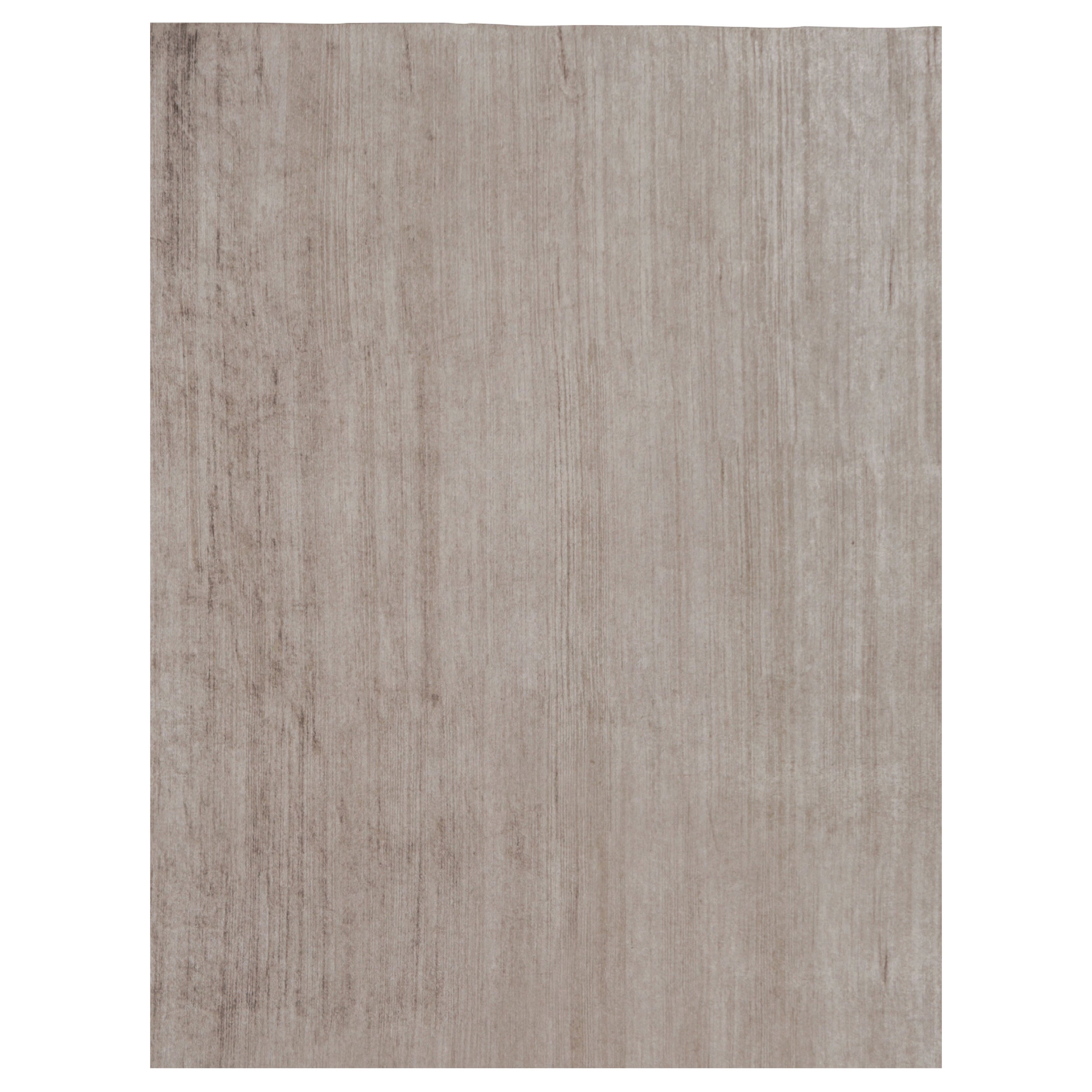 Rug 
Kilim è un tappeto moderno sovradimensionato a righe marroni, bianche e beige.