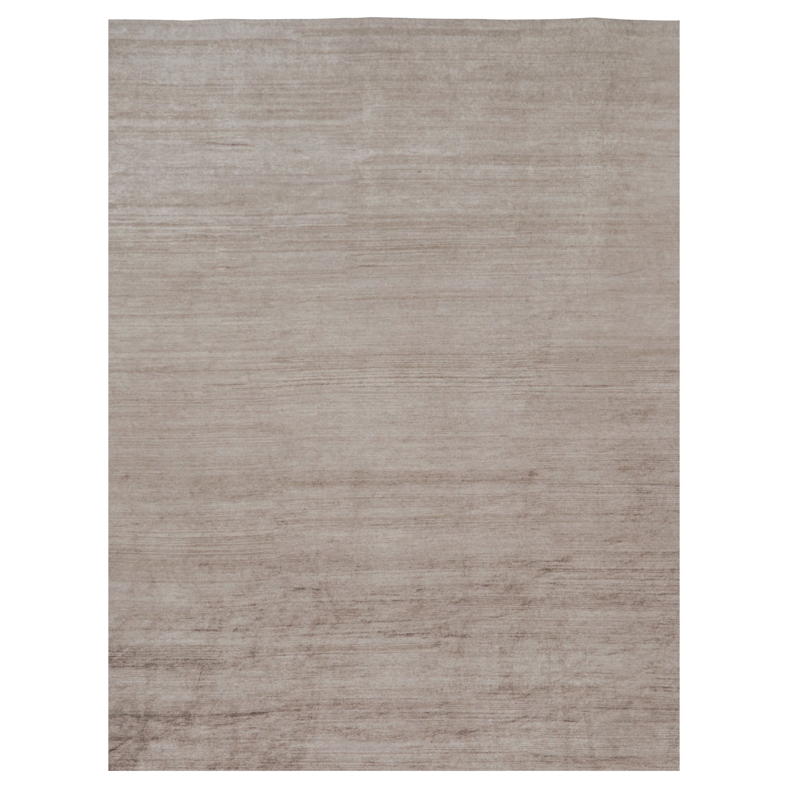 Rug 
Kilim è un tappeto moderno sovradimensionato a righe marroni, bianche e beige.