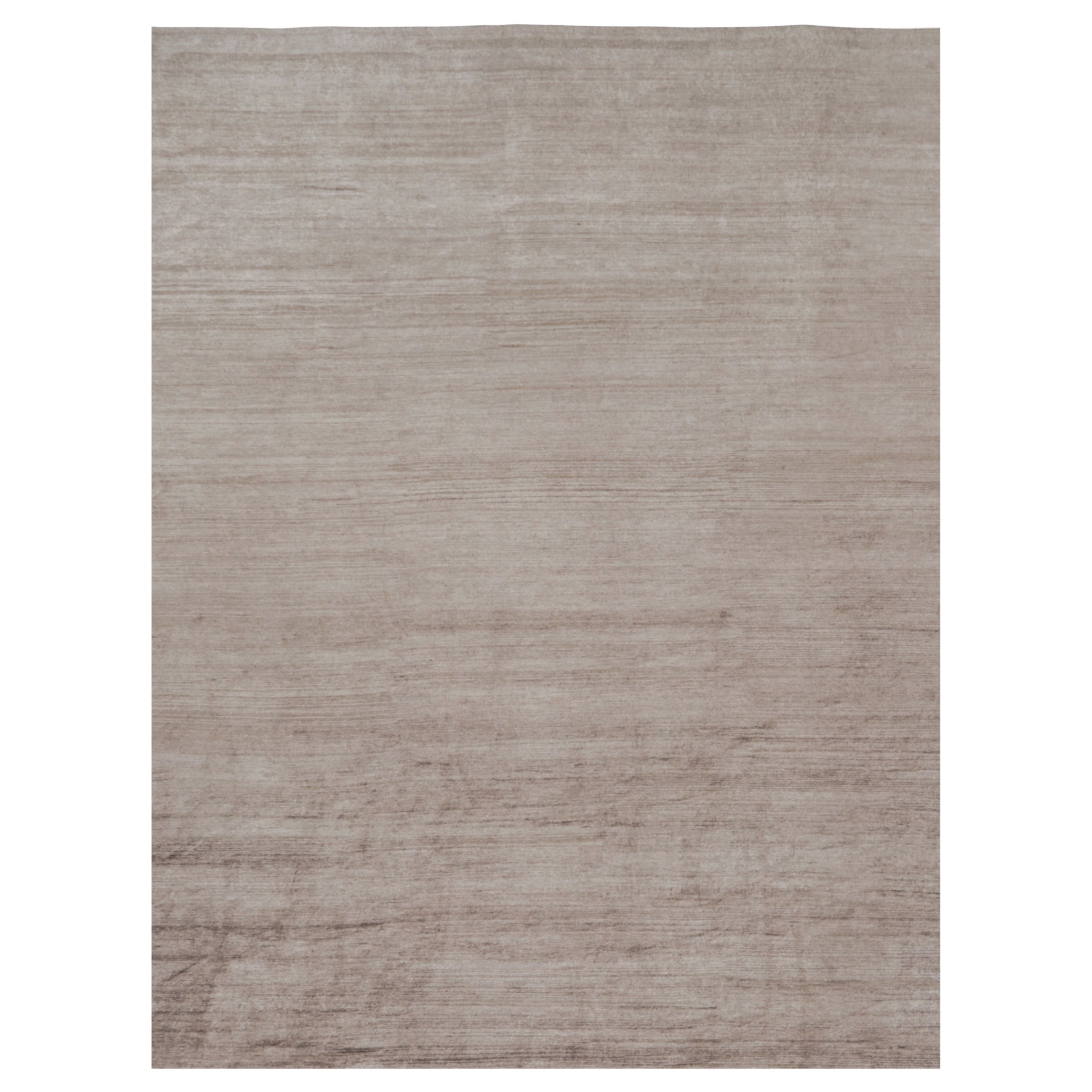 Rug 
Kilim è un tappeto moderno sovradimensionato a righe marroni, bianche e beige.