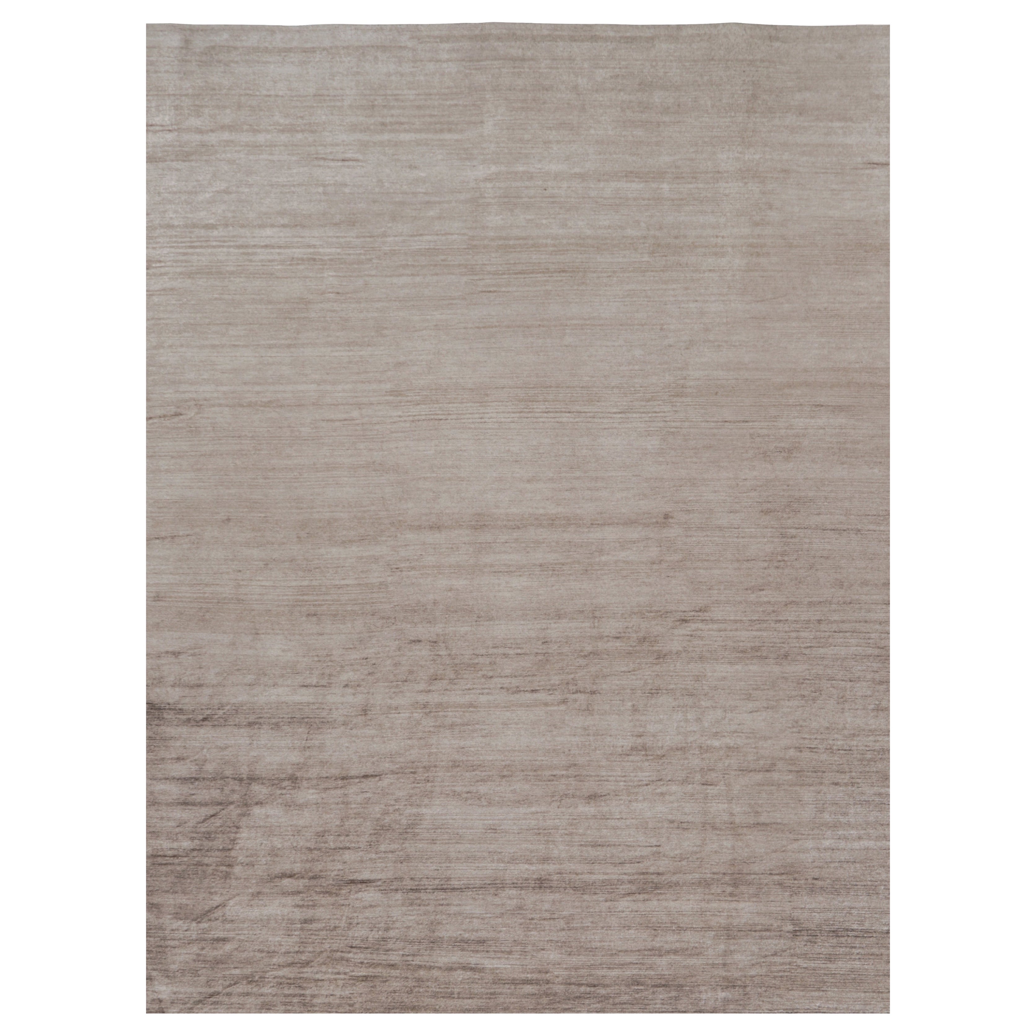 Rug 
Kilim è un tappeto moderno sovradimensionato a righe marroni, bianche e beige.