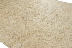 Rug & Kilim’s Oversized Persian Kashan Style Rug in Cream with Floral Patterns