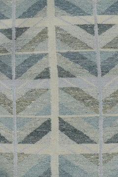 Rug & Kilim’s Oversized Scandinavian Style Rug in Blue with Geometric Patterns