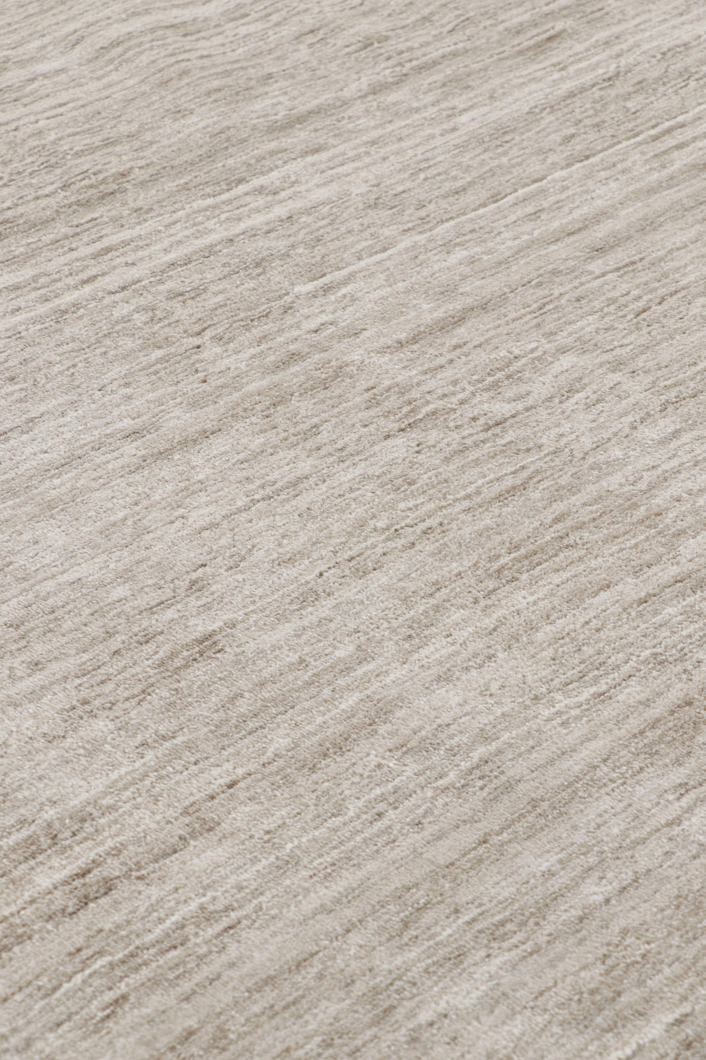 Handmade in art silk, this 12x17 rug is a rich new addition to Rug & Kilim’s Textural rug collection—with an impressive range of neutral colors and attention to movement in its unique play on stripes and striae. 

On the Design: 

Our textural