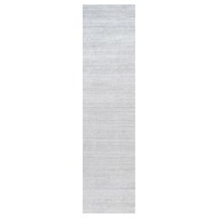 Rug & Kilim’s Oversized Textural Rug In Solid Gray and Off-White Striae