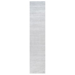 Rug & Kilim’s Oversized Textural Rug In Solid Gray and Off-White Striae