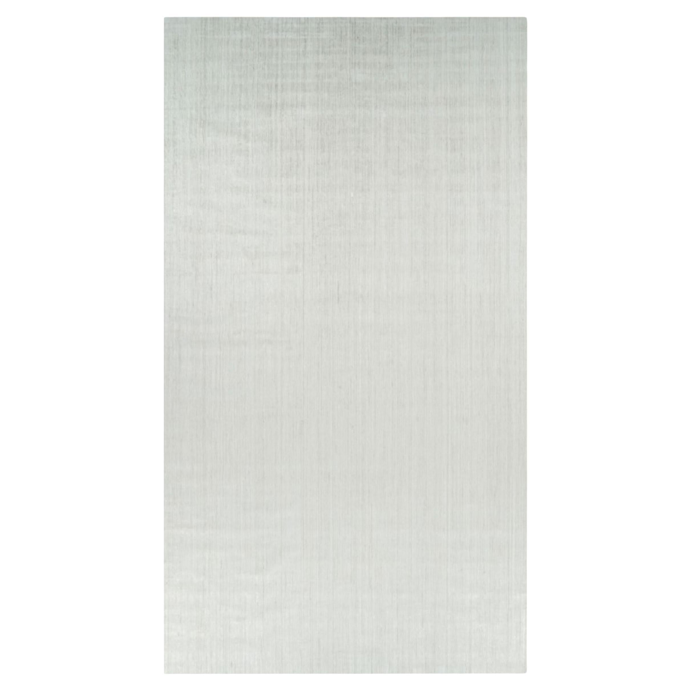 Rug & Kilim’s Oversized Textural Rug In Solid White and Silver-Gray Striae