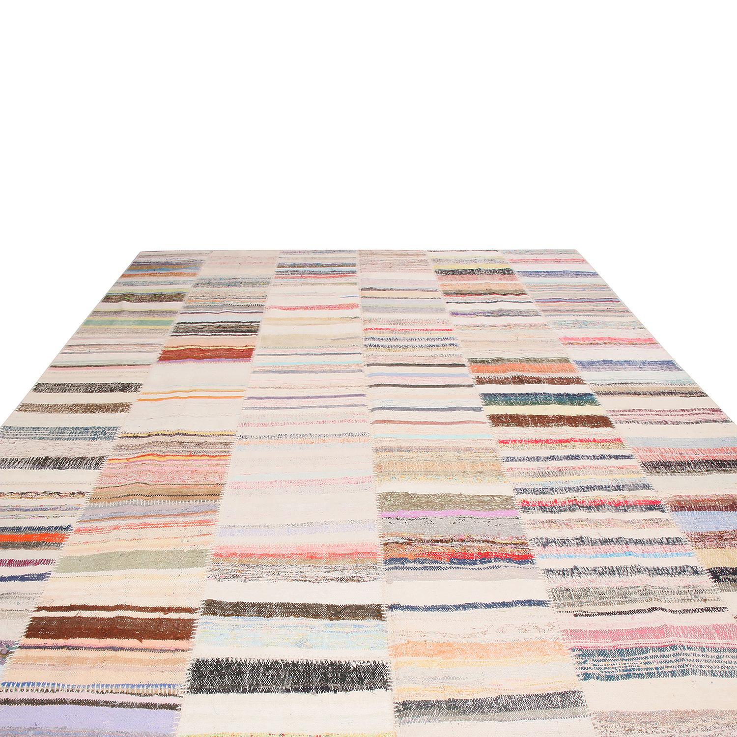 Handwoven in high-quality wool originating from Turkey, this new flat-woven geometric Kilim rug from Rug & Kilim’s patchwork collection is comprised of select pieces from vintage Kilim rugs, enjoying a spectrum of red, blue, pink, green, and other