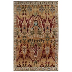 Rug & Kilim: un tappeto di ispirazione persiana con motivi floreali cremisi e oro