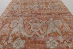 Rug & Kilim’s Persian-Inspired Rug in Warm Rust with Mauve Floral Patterns