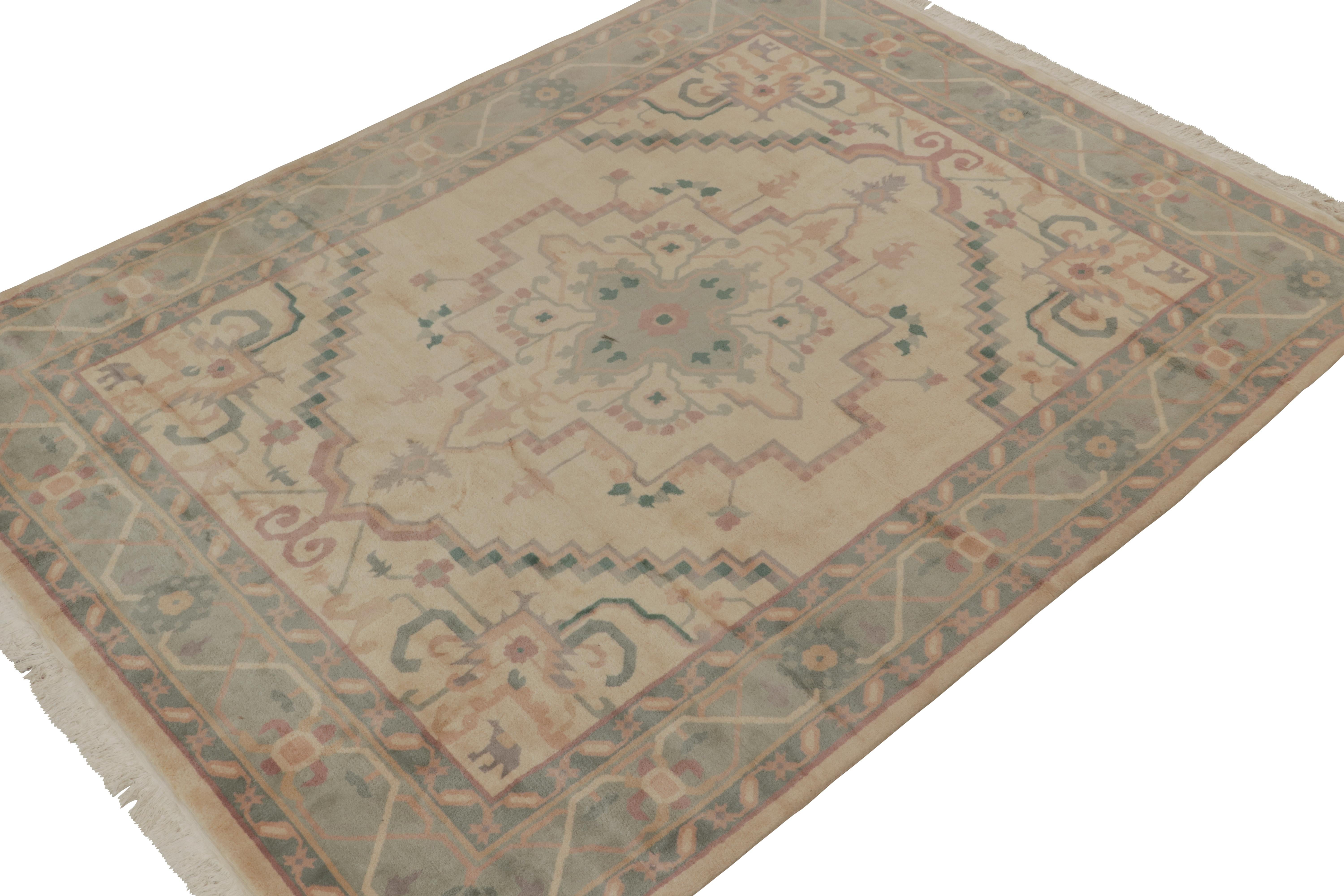 An 8x10 rug inspired from antique Persian Serapi rug styles, from Rug & Kilim’s Modern Classics Collection. Hand-knotted in wool, sporting an exceptional blue medallion style with purple accents on a beige background.

Further on the design:

The