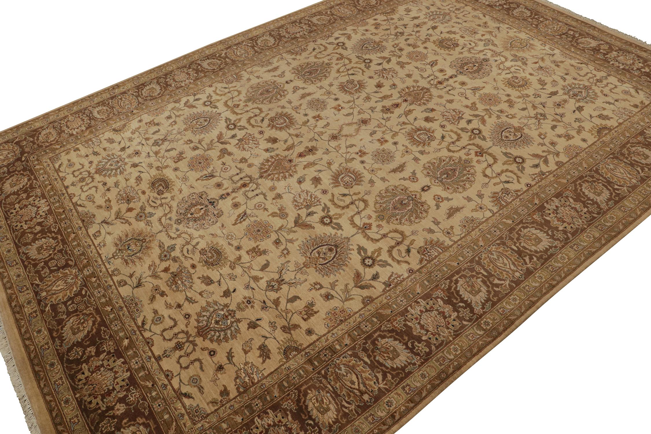 This 12x18 hand-knotted wool rug from our Modern Classics collection is an ode to regal antique Tabriz Persian rugs. 

A grand scale hosts the finest floral detailing & palmettes in rich beige-brown & gold, with kisses of other vivid colors. A