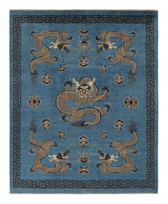 Rug & Kilim’s Pictorial Dragon Rug in Navy Blue, with Geometric Borders