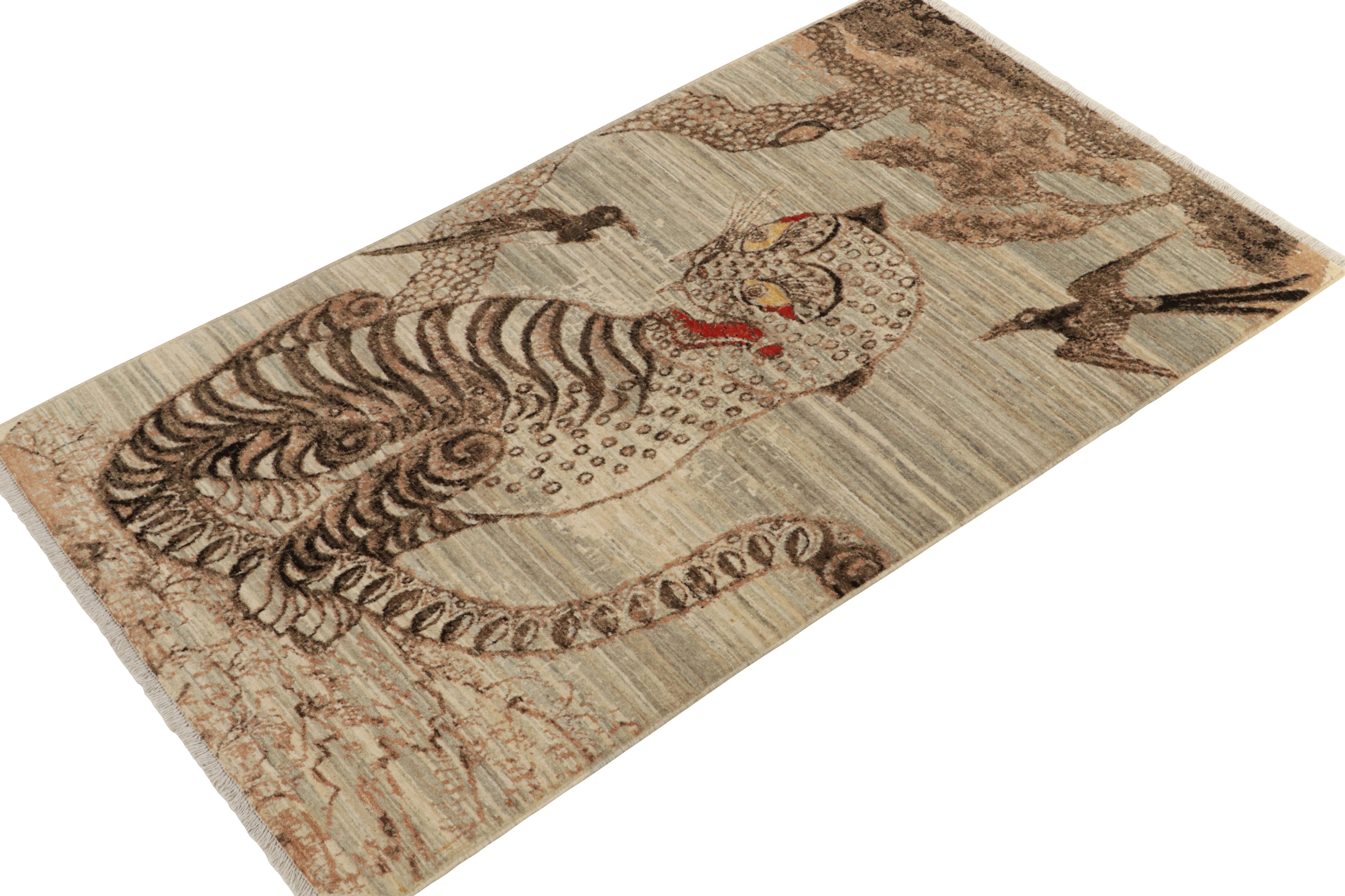 Hand knotted in wool, Rug & Kilim presents this 3x5 piece from its exclusive Tiger line. An exemplary drawing with pictorial representation enjoying a subtle pelt pattern in striaed beige-brown and gray with kisses of red and gold for a bold, yet