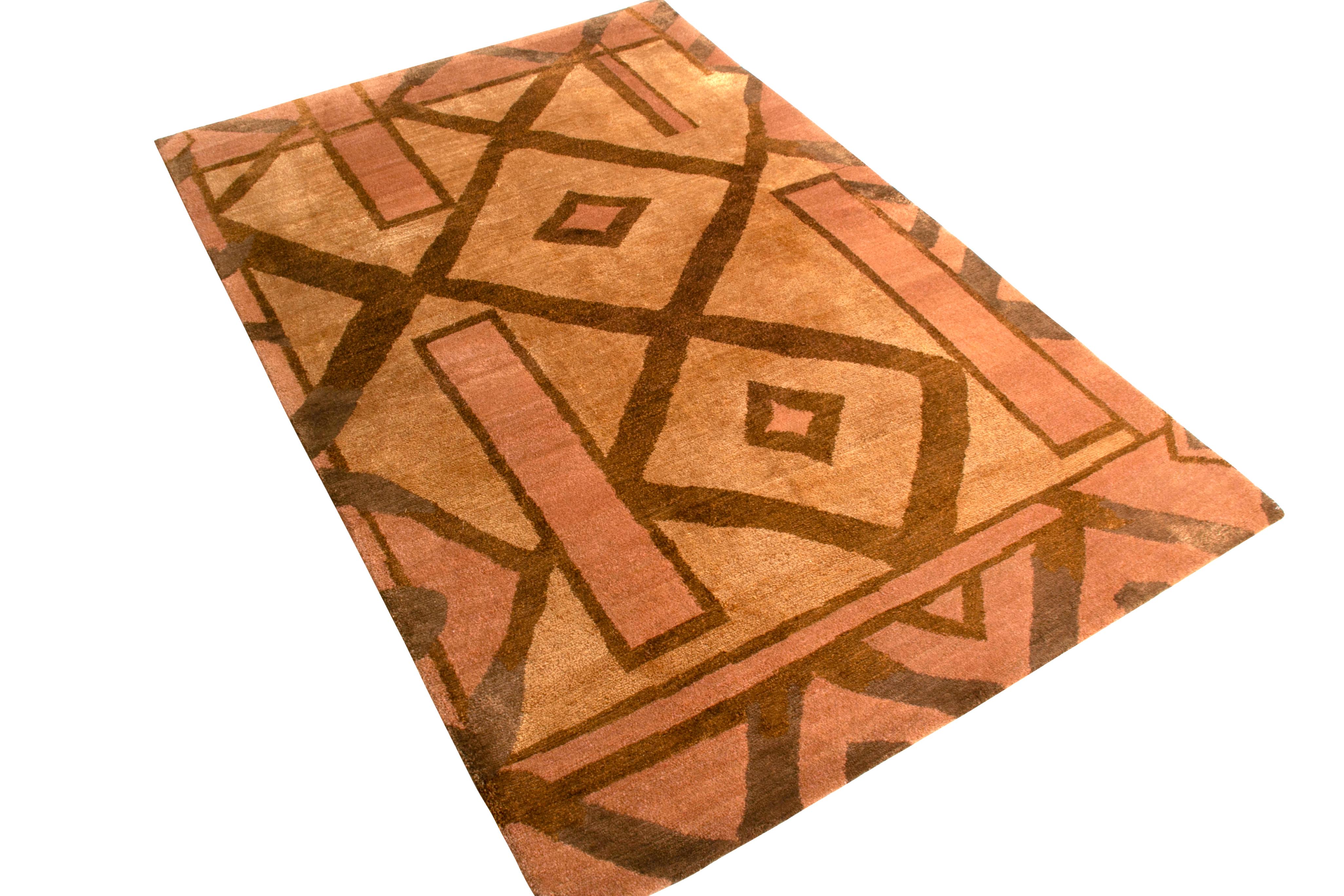 Hand knotted in wool and silk, this 4 x 6 rug from the New & Modern Collection by Rug & Kilim draws inspiration from cubist patterns with a modern color perspective; an array of luminous beige-brown and pink hues complemented by the silk’s natural