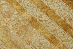 Rug & Kilim’s Samarkand-Inspired Rug, Muted Geometric-Floral Patterns in Gold