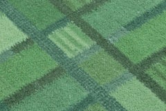 Rug & Kilim’s Scandinavian-Inspired Accent rug with Green Geometric Patterns