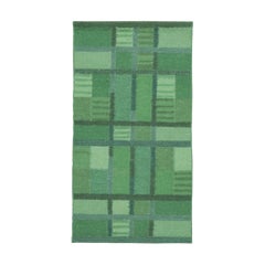 Rug & Kilim’s Scandinavian-Inspired Accent rug with Green Geometric Patterns