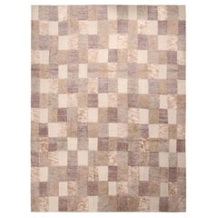 Rug
Kilim è un tappeto di ispirazione scandinava in lana beige, marrone e grigio.