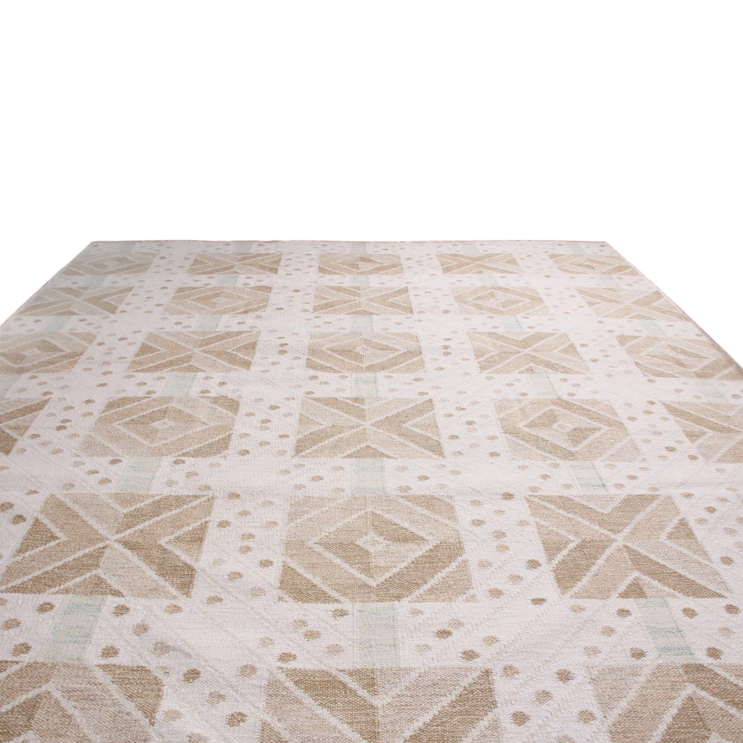 Rug & Kilim’s handwoven Swedish-style rug hails from the latest natural wool flat-weave additions to the Scandinavian Collection, offering our unique, refined large-scale approach to the geometry and vintage colorways like that of their mid-century