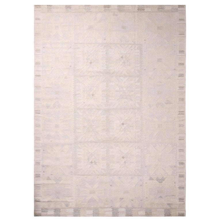 Rug and Kilim’s ScandinavianInspired Cream Gray and Lavender Wool Pile