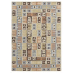 Rug & Kilim’s Scandinavian-Inspired Custom Rug with Colorful Geometric Patterns