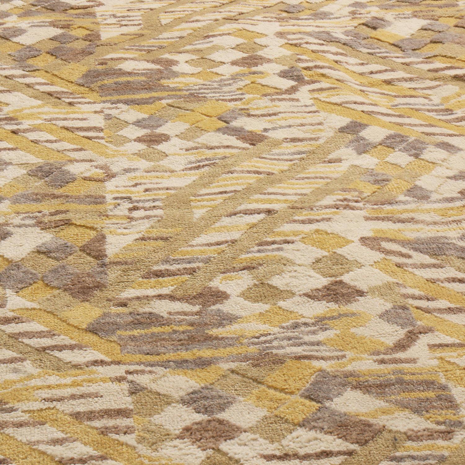 Originating from India, this hand knotted contemporary pile rug hails from Rug & Kilim’s Scandinavian-inspired collection, featuring a distinct dimensional all-over field design with golden-yellow and multi-tonal beige colourways with lively blue