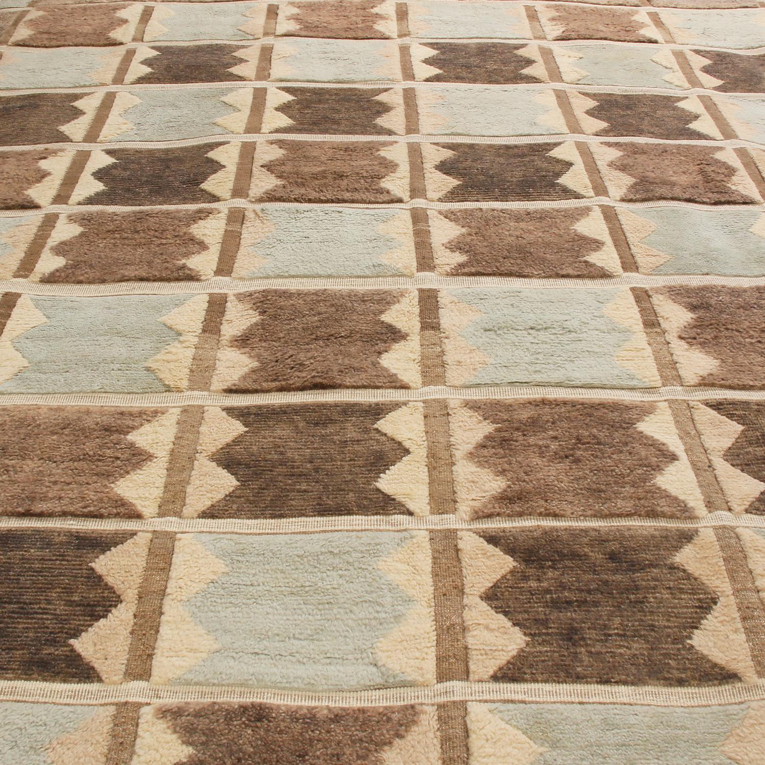 Originating from India, this hand knotted contemporary pile rug hails from Rug & Kilim’s Scandinavian-inspired collection, featuring a distinct patchwork all-over field design with bold black, off-white, gray, and multi-tonal blue colorways.
 