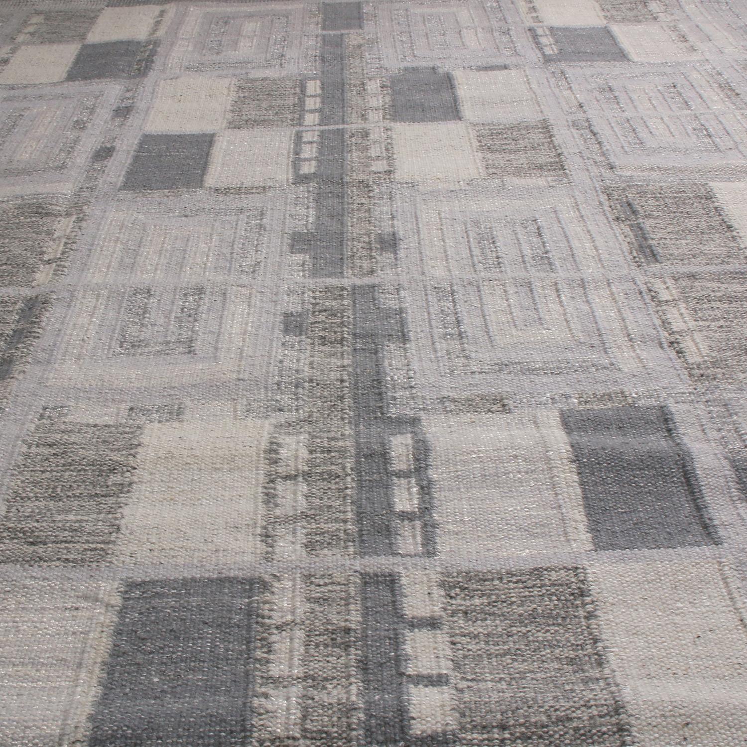A 9x12 ode to celebrated Swedish flat weave styles from Rug & Kilim’s Scandinavian-inspired kilim collection, handwoven with high-quality New Zealand wool featuring a chic geometric all-over field design with Industrial and forgiving multi-tonal