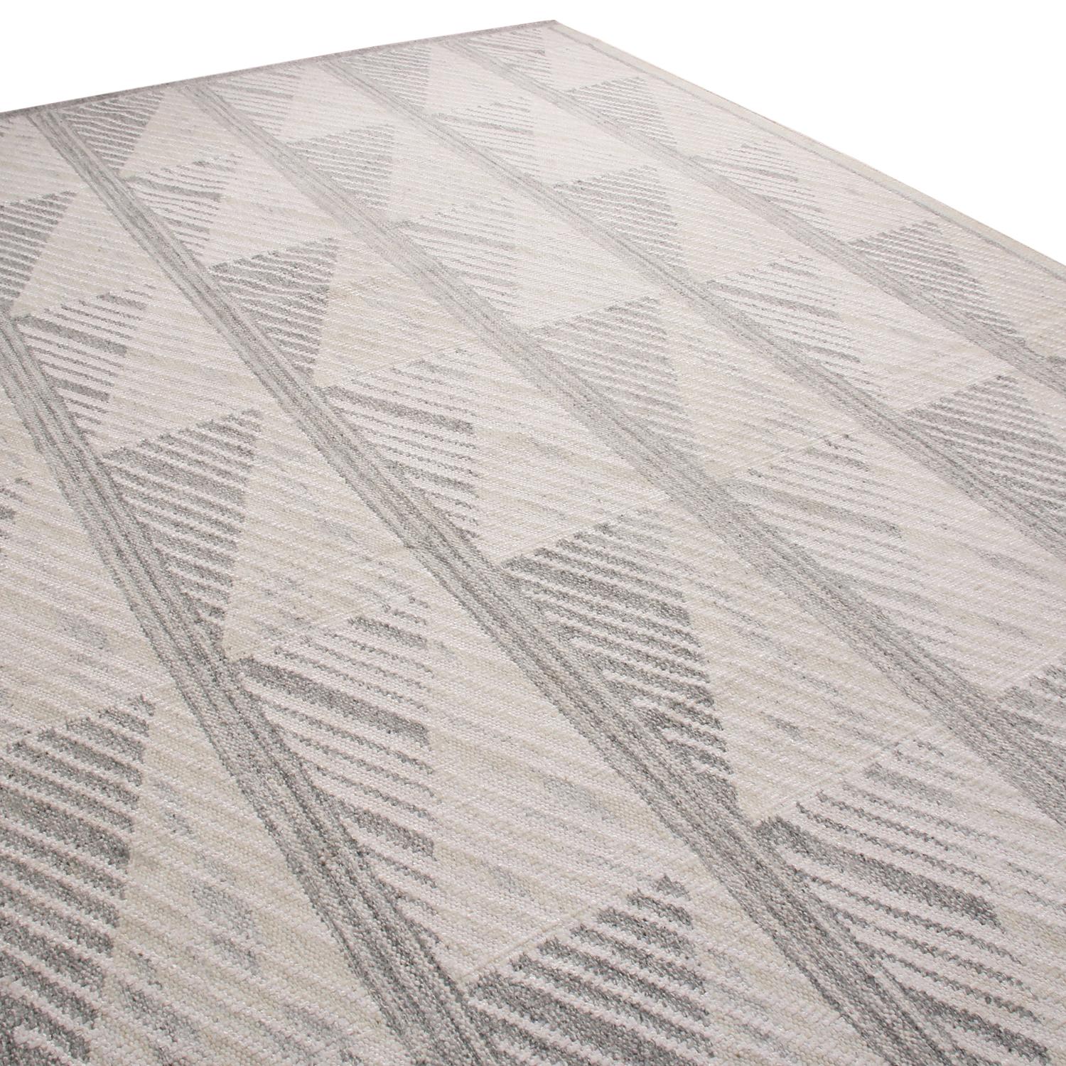 Rug & Kilim’s hand-woven Swedish-style rug hails from the latest wool flat weave additions to the Scandinavian Collection, offering our unique, refined large-scale approach to the geometry and vintage colorways like that of their mid-century