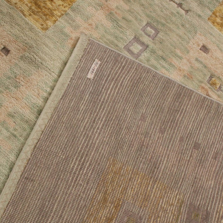 Rug and Kilim’s ScandinavianInspired Geometric Green and Gold Wool