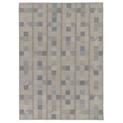 Kilim de inspiración escandinava de Rug & Kilim con motivos geométricos en azul y gris