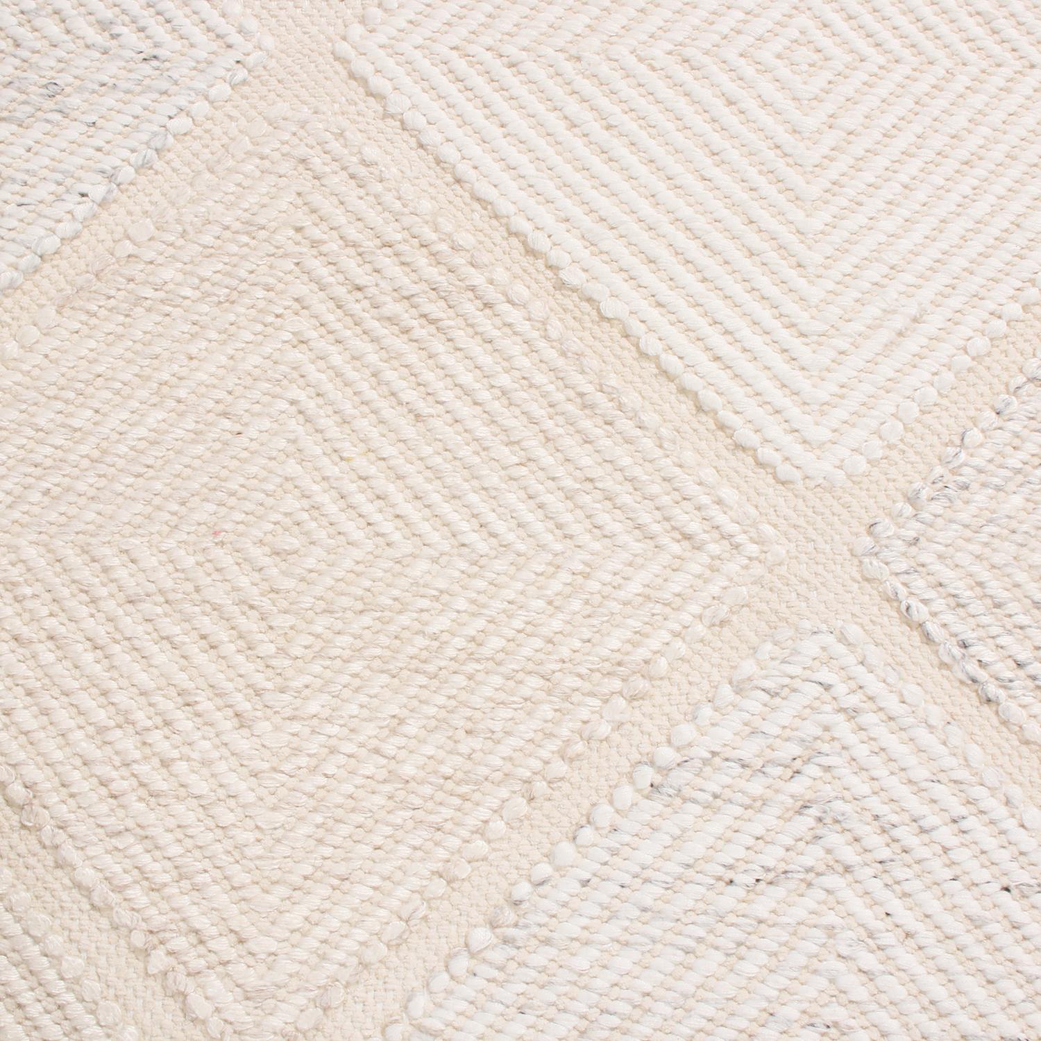 Originating from India, this natural polyester rug hails from Rug 
Kilim’s Outdoor Scandinavian collection, featuring designs including this rippling interpretation of celebrated Moroccan diamond patterns in multi-tonal cream white, blue, and