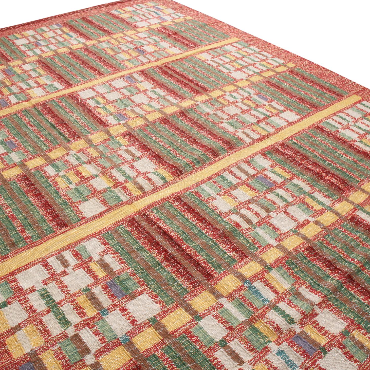 Originating from India, this hand knotted pile rug hails from Rug & Kilim’s Scandinavian-inspired collection, featuring a distinct tribal geometric all-over field design with bold red, green, and multi-tonal beige color ways. This design is