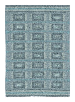 Rug & Kilim è un tappeto di ispirazione scandinava con motivi geometrici grigi e blu