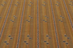 Rug & Kilim’s Scandinavian-Inspired Rug, “Marta Stripe” Design in Gold Tones