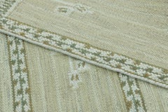 Rug & Kilim’s Scandinavian-Inspired Rug, “Marta Stripe" design in Sage and Olive