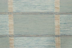 Rug & Kilim’s Scandinavian-Inspired Rug with Light Blue Geometric Patterns