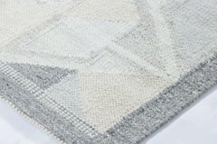 Alfombra de calle Rug & Kilim de inspiración escandinava, con motivos geométricos en gris y azul