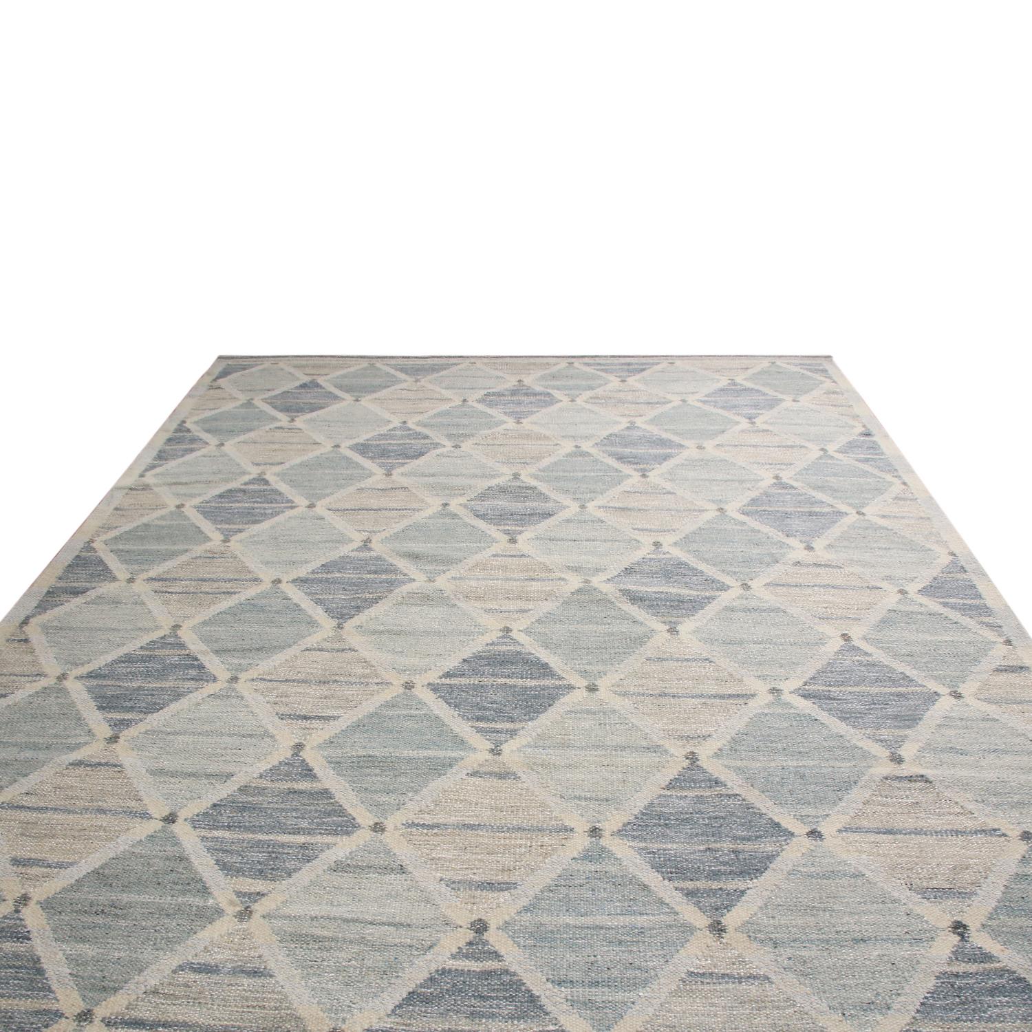 Rug & Kilim’s hand woven Swedish-style rug hails from the latest wool flat weave additions to the Scandinavian collection, a celebration of large-scale geometry and exciting vintage colorways like that of their mid-century inspirations. The abrashed
