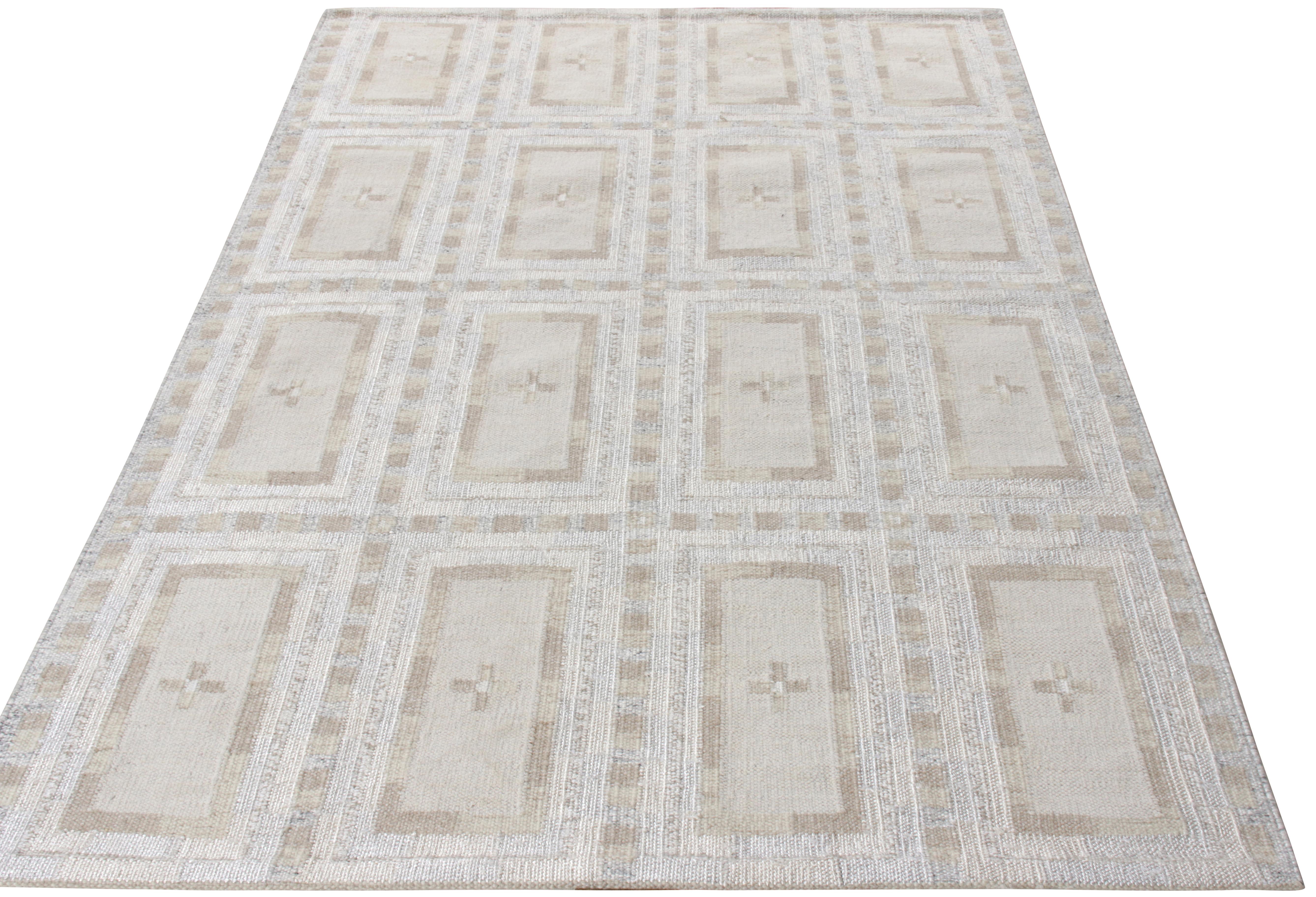 A 6x9 handwoven wool Kilim from Rug & Kilim’s award-winning Scandinavian flat weave collection. Flaunting a symmetric geometric design in beige, white and gray, the rug features an enticing sense of movement that makes a captivating appeal in