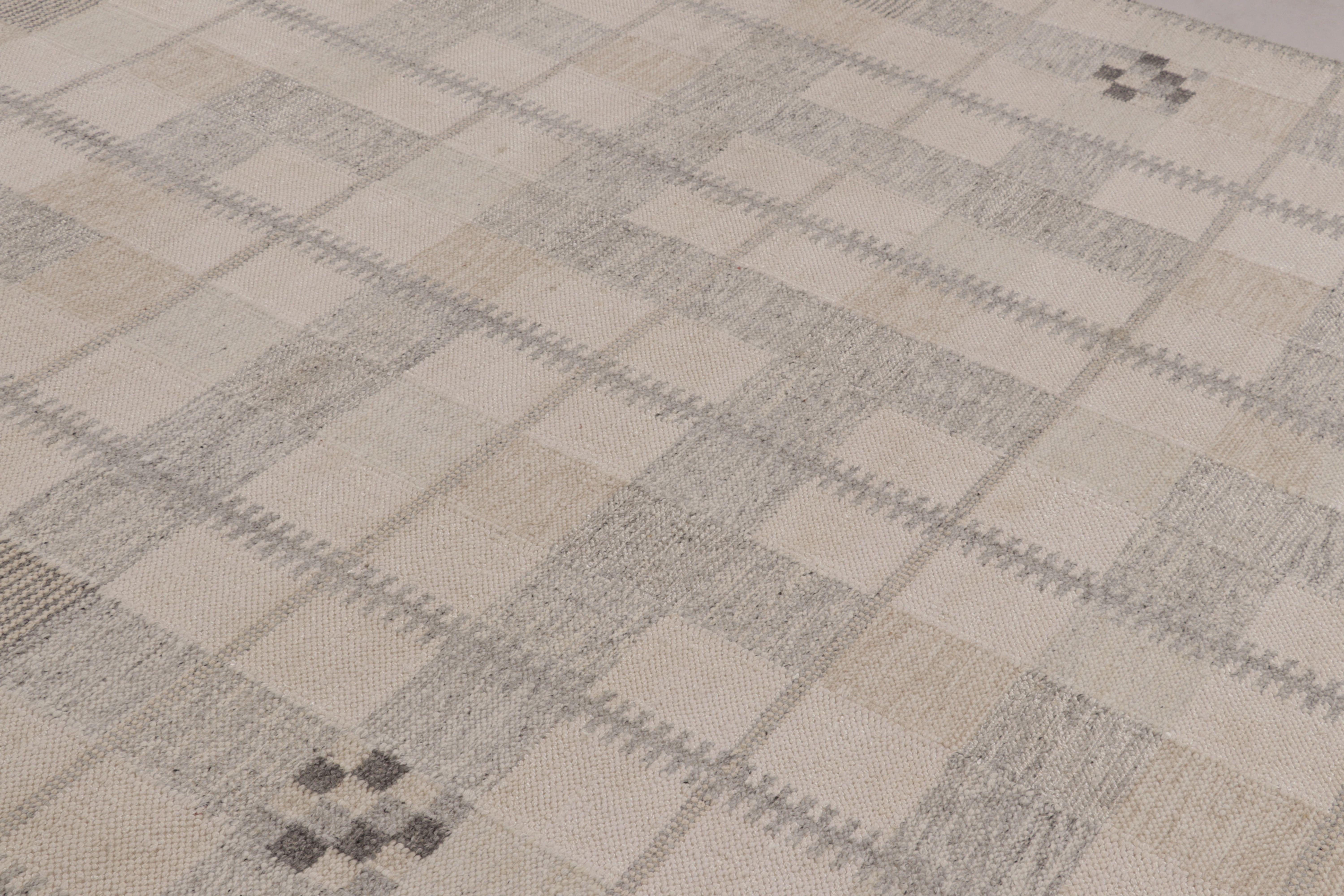 Hand-woven in wool, this 8x10 flatweave is an exceptional new entry in Rug & Kilim’s award-winning Scandinavian rug collection, features a stunning geometric pattern in undyed natural yarns and high-contrast dark accents. This proprietary design